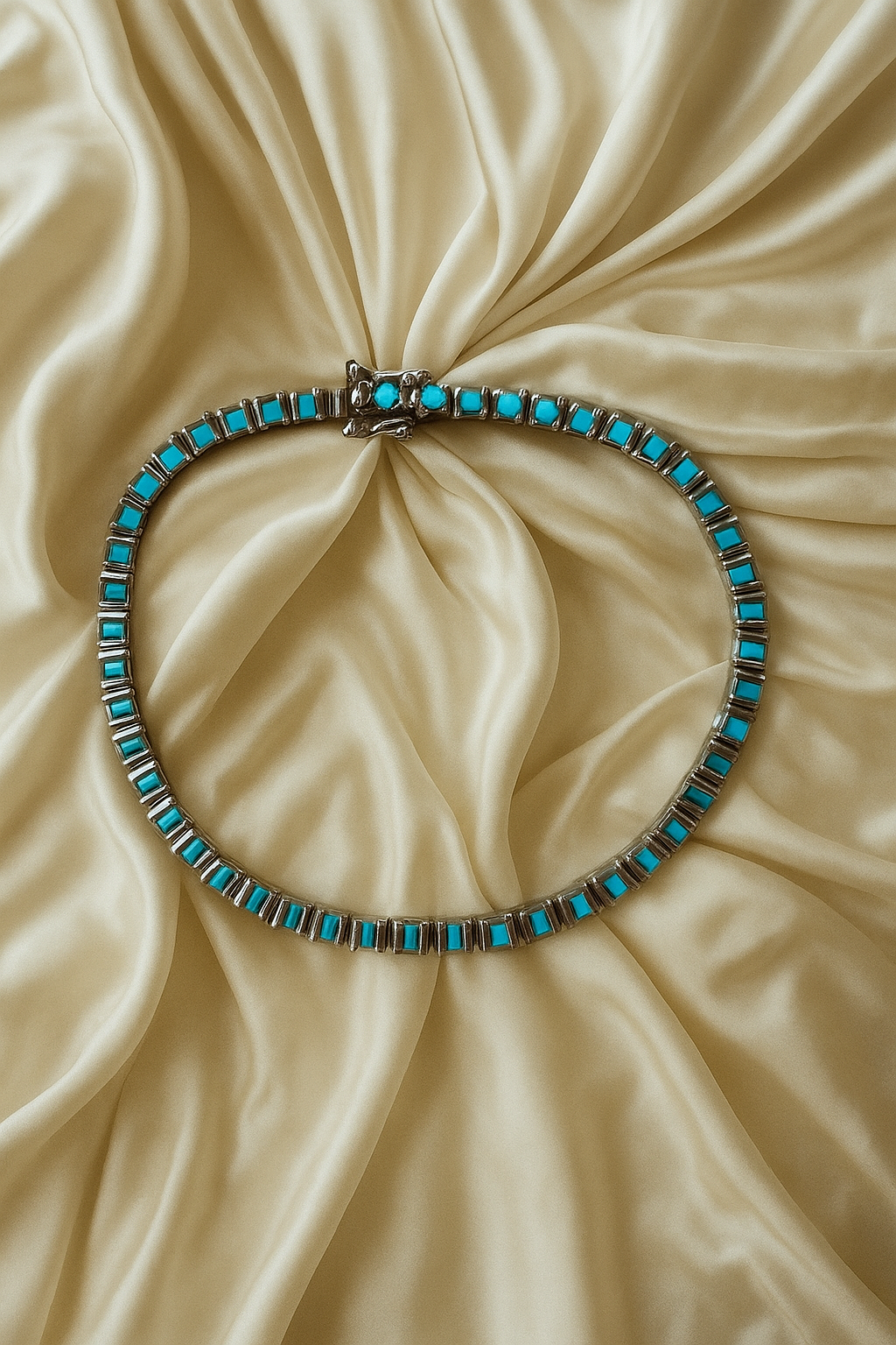 Turquoise beaded bracelet on a beige fabric background