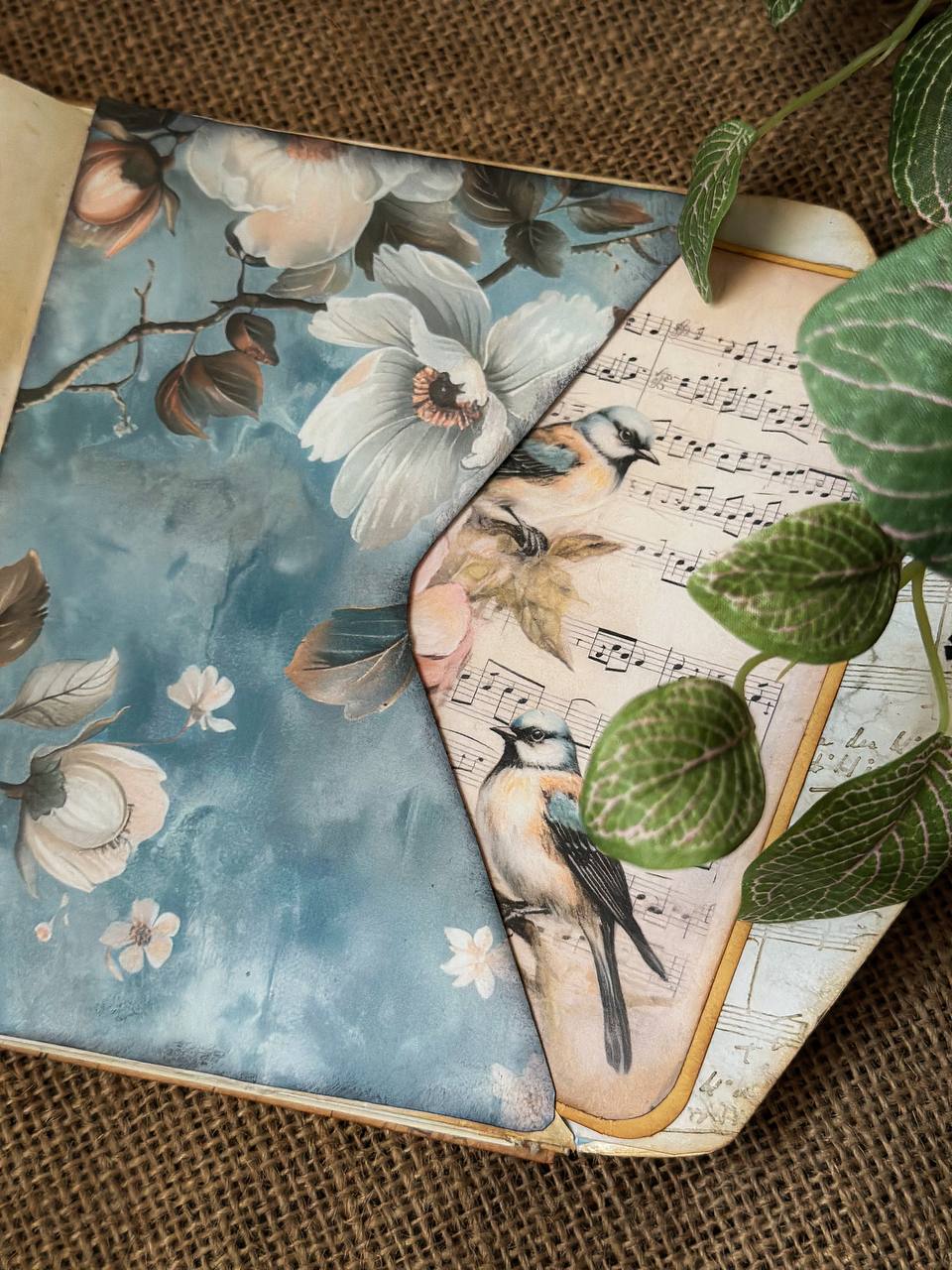 Inside page of Suzys Treasures vintage envelope journal featuring a decorative 'To Do' list insert with floral and leaf illustrations, set on aged paper with green leaf accents and rustic textures.