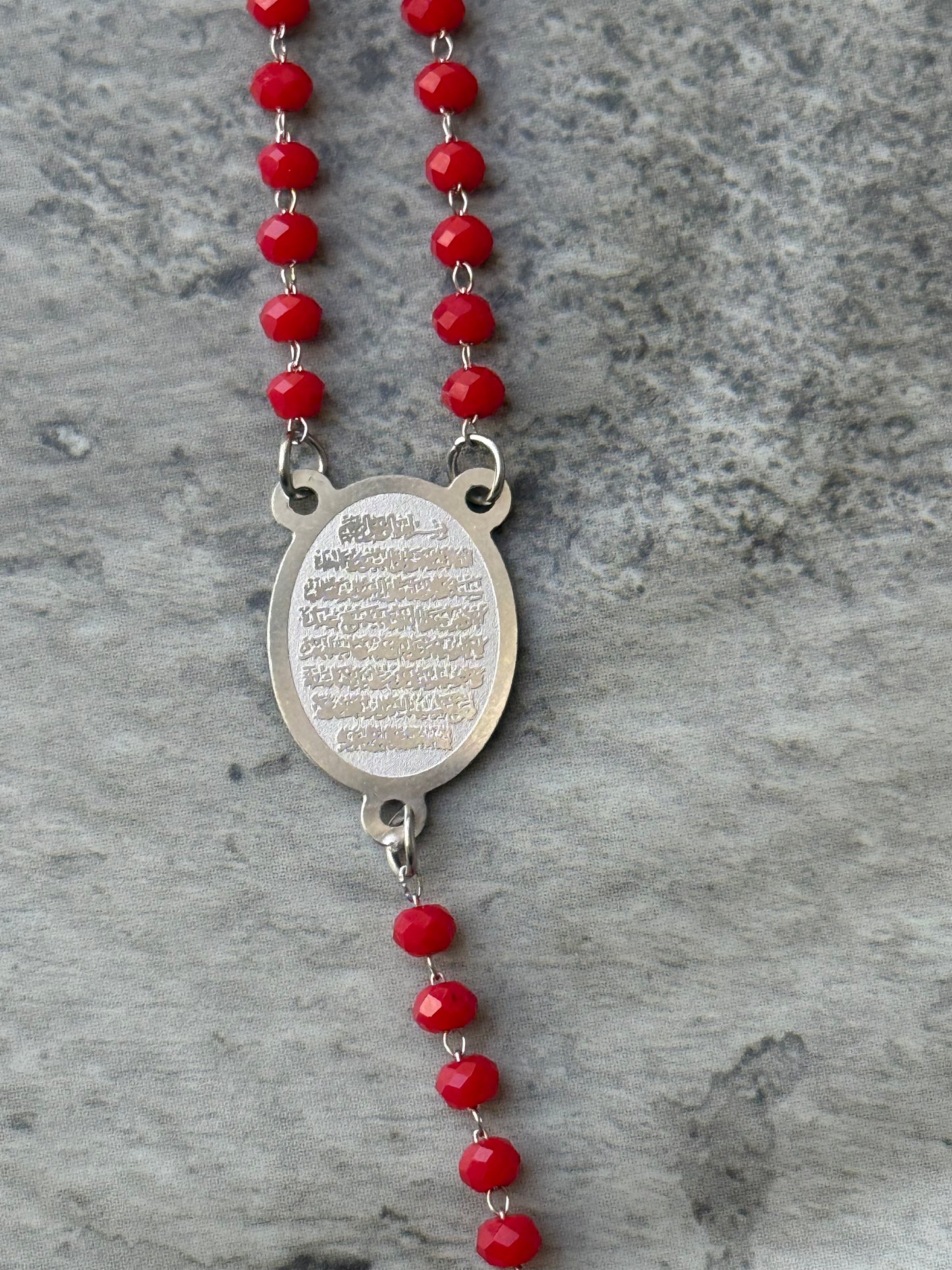 Close-up of Ayat Al-Kursi pendant on red beaded necklace, handmade Islamic jewelry for women - Suzys Treasures