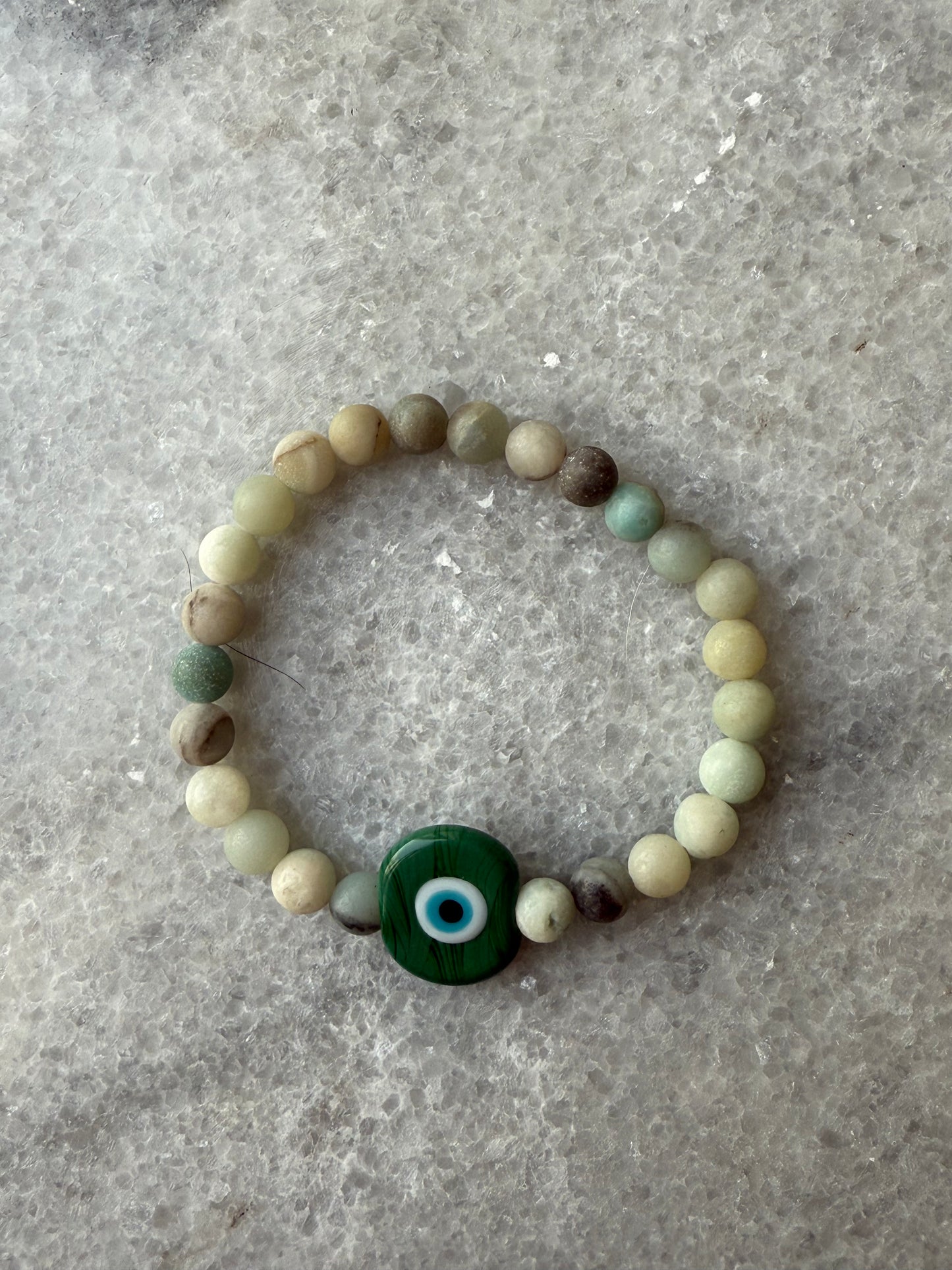 Crystal bead evil eye bracelets with Murano-style glass charms in green, handmade jewelry by Suzys Treasures