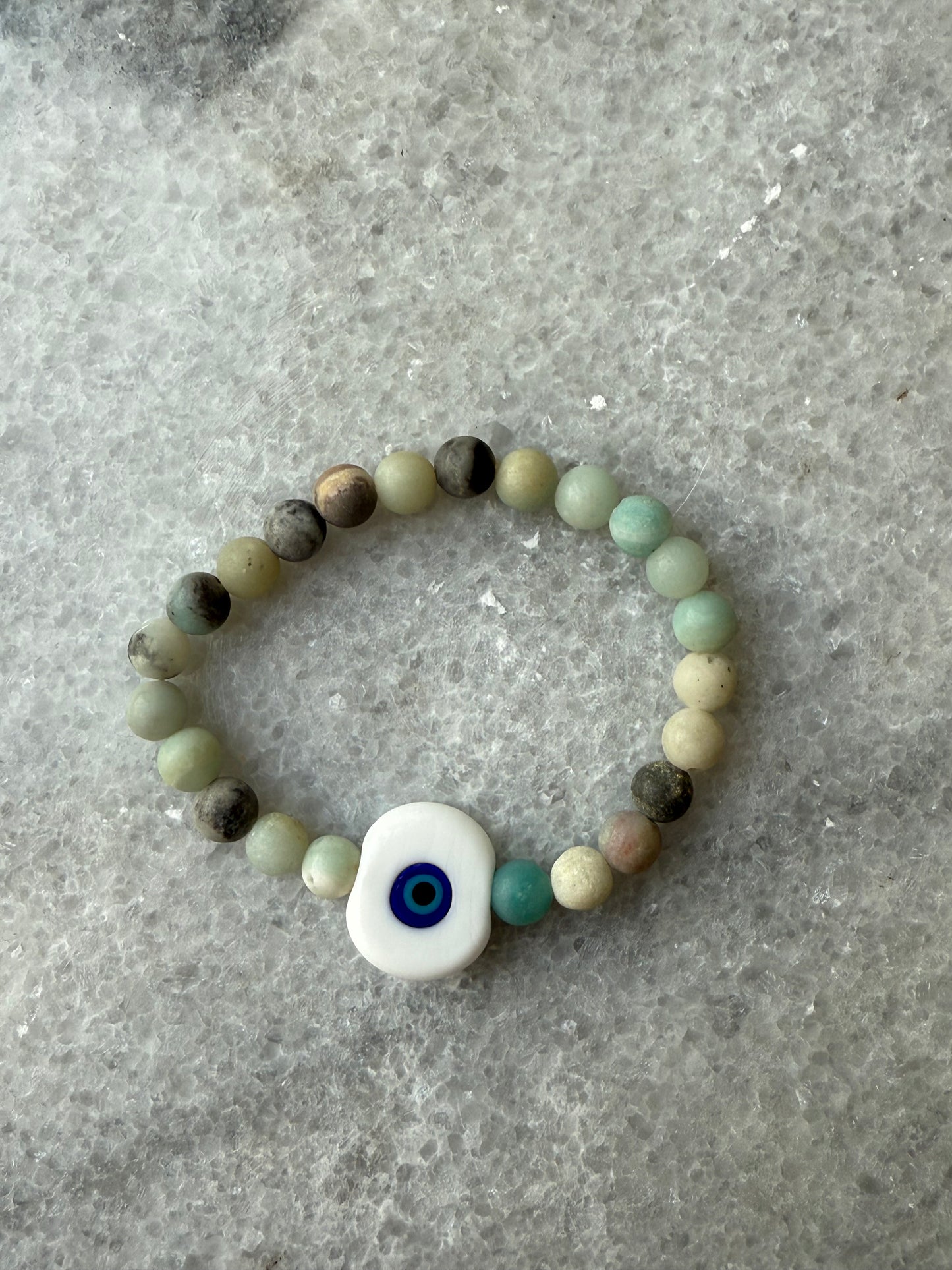 crystal bead evil eye bracelets with Murano-style glass charms in white, handmade jewelry by Suzys Treasures