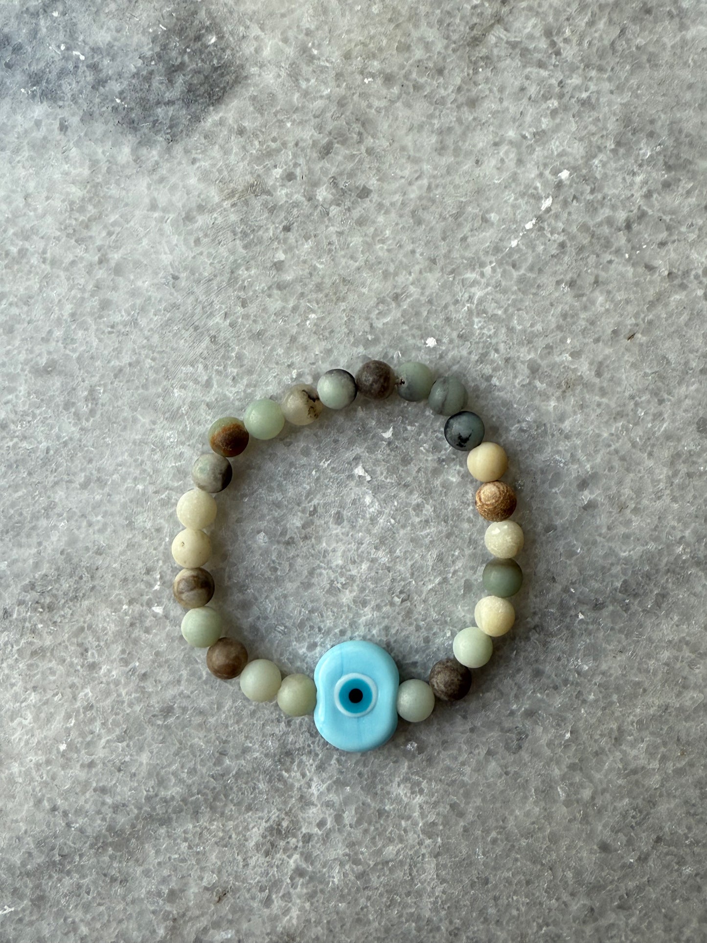 crystal bead evil eye bracelets with Murano-style glass charms in blue, handmade jewelry by Suzys Treasures