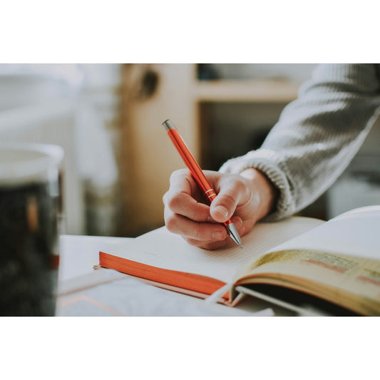 Woman practicing gratitude journaling for beginners with a mindfulness approach