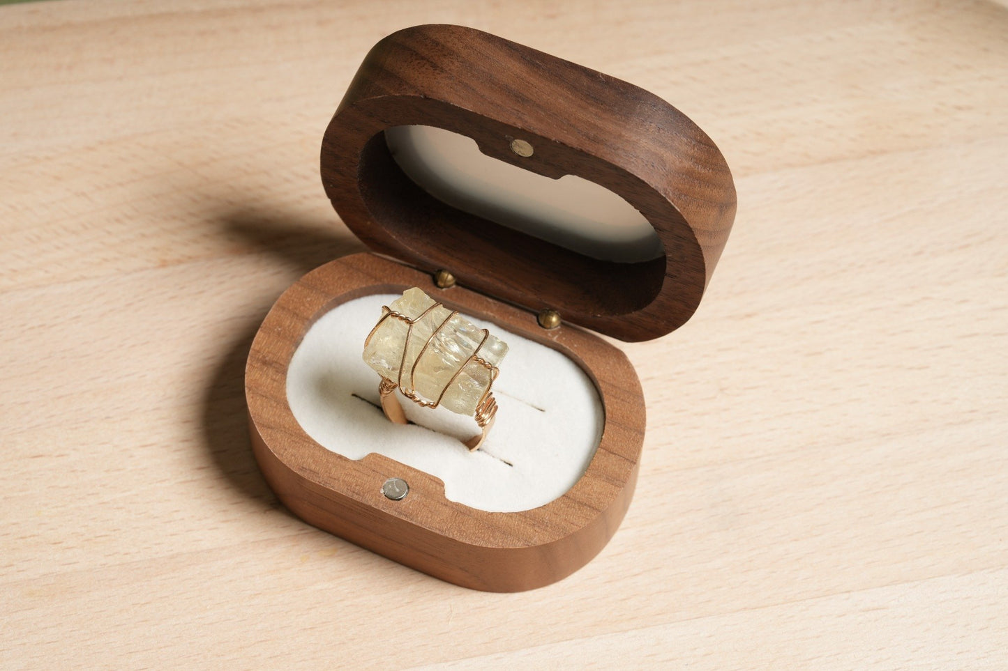 Raw citrine crystal wire-wrapped gold plated ring displayed in a wooden ring box – Suzys Treasures.

