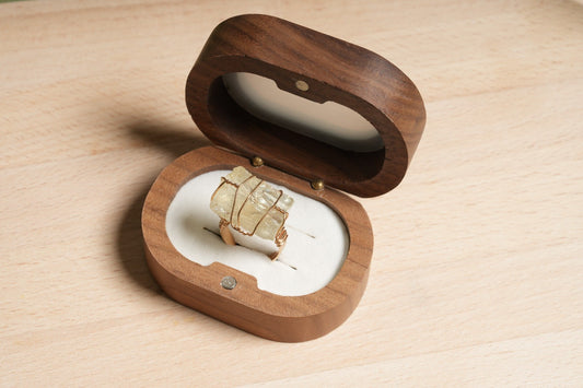 Raw citrine crystal wire-wrapped gold plated ring displayed in a wooden ring box – Suzys Treasures.

