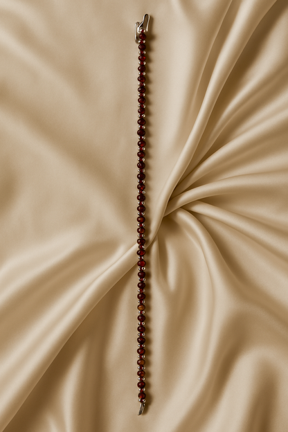 Beaded necklace on a beige fabric background