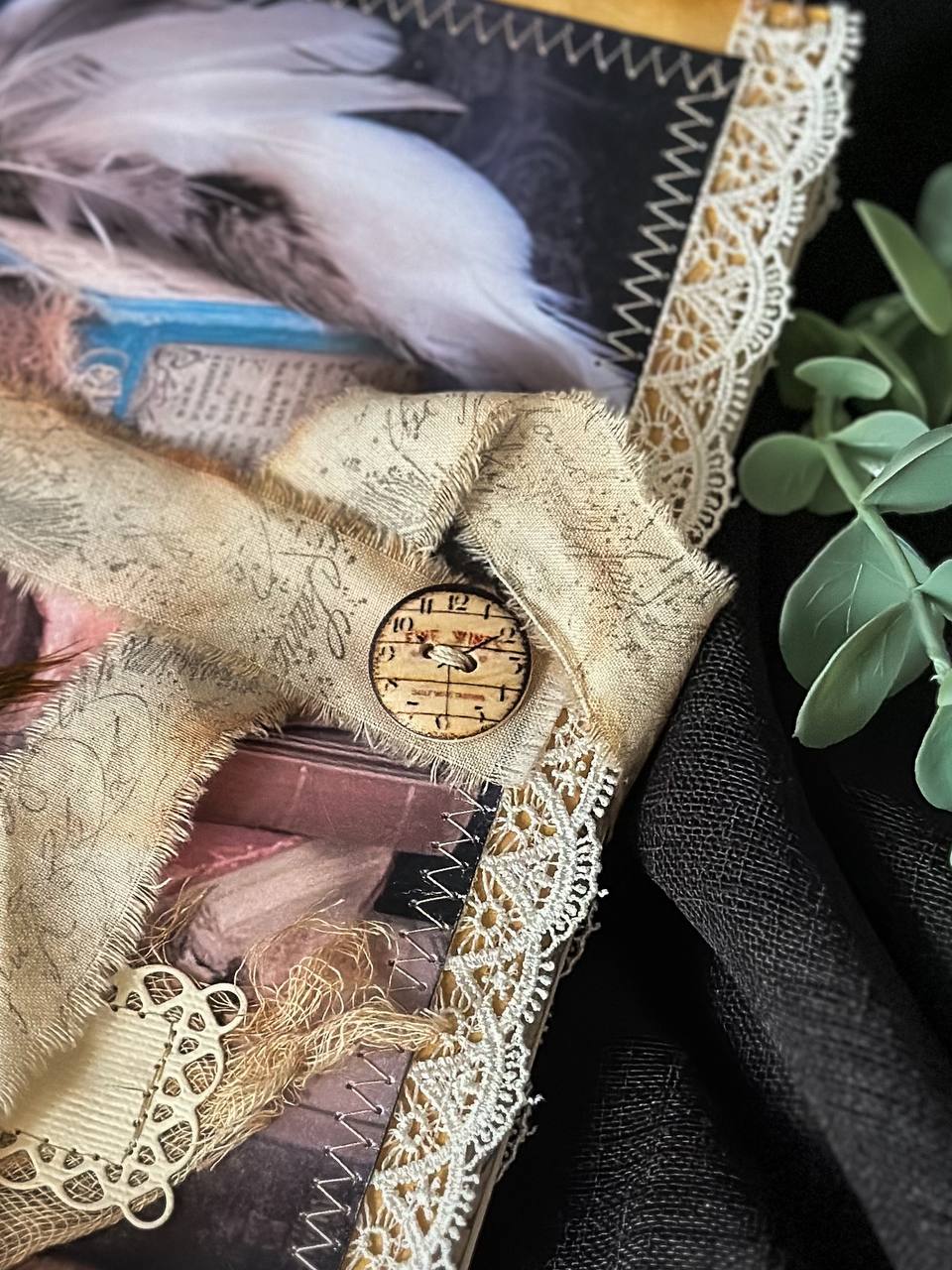 Handmade vintage-inspired journal featuring feathers, apothecary bottles, and lace detailing – a whimsical creation from Suzys Treasures.
