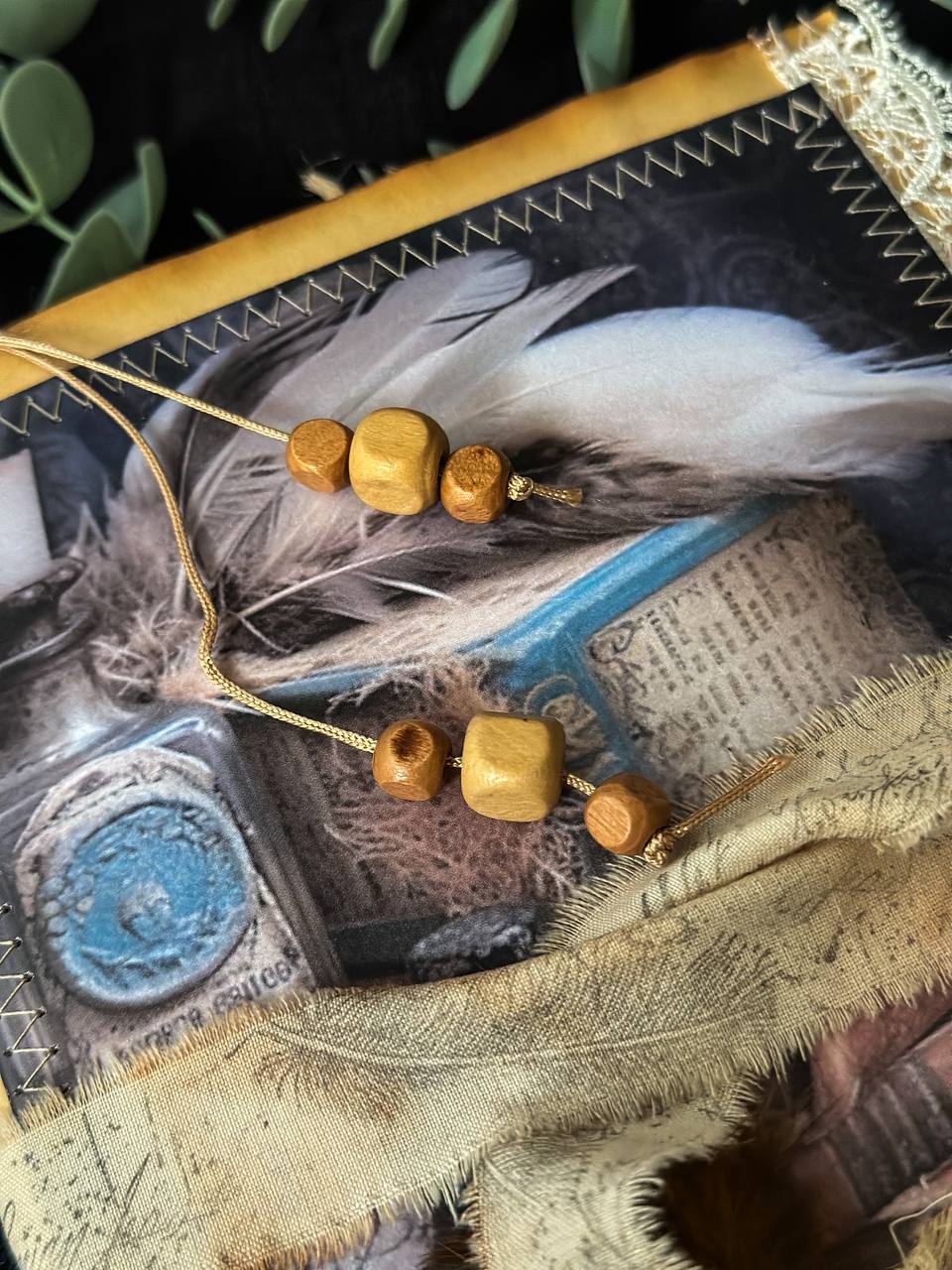 Handmade vintage-inspired journal featuring feathers, apothecary bottles, and lace detailing – a whimsical creation from Suzys Treasures.