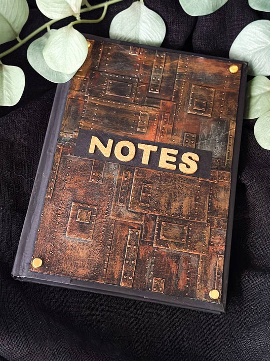 Rustic faux leather notebook with bold 'NOTES' cover design and metal corner accents from Suzys Treasures – perfect for journaling, sketching, or gifting.
