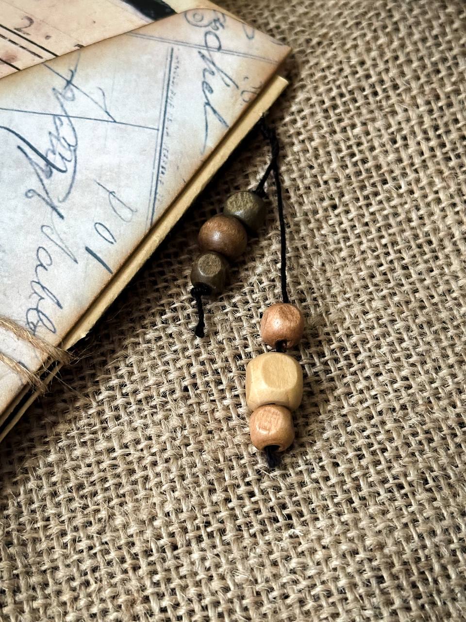 Detail shot of Suzys Treasures vintage grunge mini envelope journal, showing layered aged paper with French text and handwritten script.
