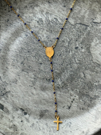 Close-up of lapis lazuli and gold cross pendant with Virgin Guadalupe, elegant faith-based jewelry for women by Suzys Treasures.
