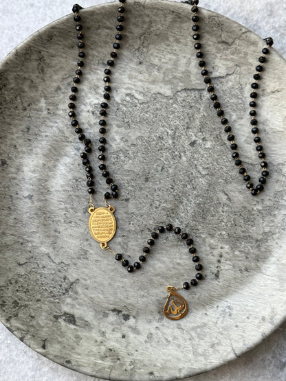 Close-up of Ayat Al-Kursi pendant on black beaded necklace, handmade Islamic jewelry for women - Suzys Treasures