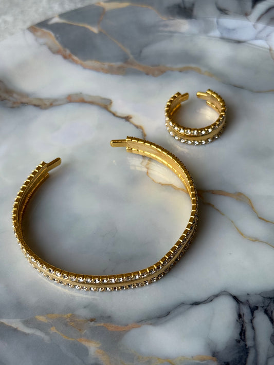 Gold-plated copper bangle and adjustable ring set with double rows of zirconia crystals on marble background – Suzys Treasures