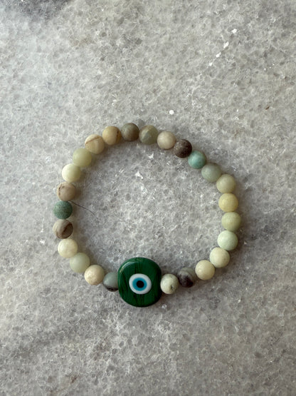 Crystal bead evil eye bracelets with Murano-style glass charms in green, handmade jewelry by Suzys Treasures