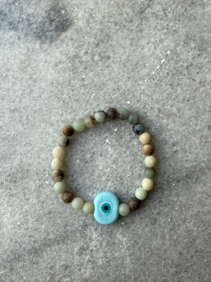 crystal bead evil eye bracelets with Murano-style glass charms in blue, handmade jewelry by Suzys Treasures