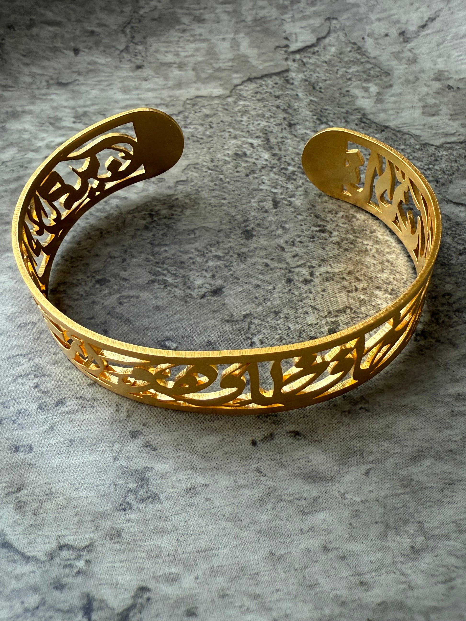 Laser-cut Arabic verse bracelet in 3-micron gold plating with Surah Yusuf inscription – faith-inspired cuff by Suzys Treasures