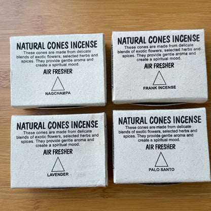 Four boxed natural incense cones in scents: Nag Champa, Lavender, Palo Santo, and Frankincense. Displayed on a wooden surface, available from Suzy’s Treasures.