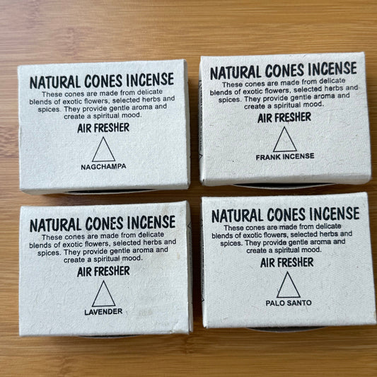 Four boxed natural incense cones in scents: Nag Champa, Lavender, Palo Santo, and Frankincense. Displayed on a wooden surface, available from Suzy’s Treasures.