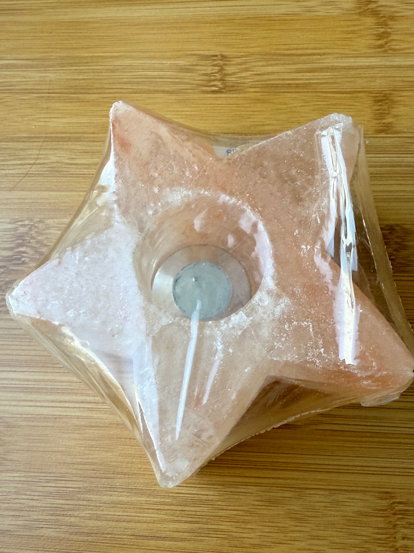Star-shaped Himalayan salt candle holder crafted from pink salt rock sourced in Pakistan, designed for holding tealight candles and enhancing spiritual ambiance, available at Suzys Treasures.