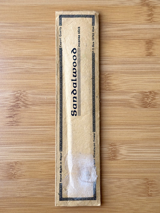 Handmade incense stick pack in Sandalwood, wrapped in eco-friendly lokta paper, 100% natural and made in Nepal, part of the Sacred Scents & Space collection by Suzy’s Treasures.