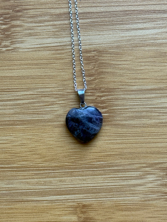 Amethyst heart-shaped pendant with sterling silver chain on wooden background – Suzys Treasures