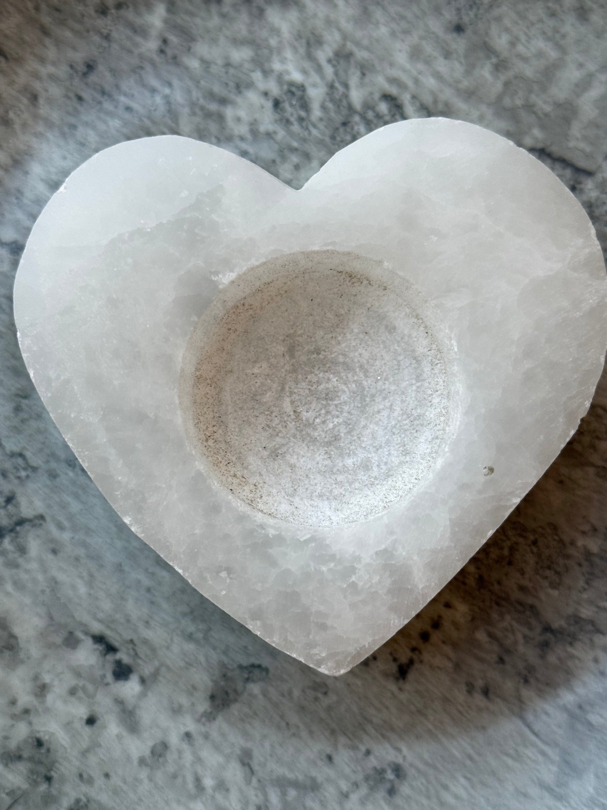 Heart-shaped white selenite crystal candle holder designed for tealights, symbolizing love and energy cleansing, part of the Sacred Scents & Space collection at Suzys Treasures.