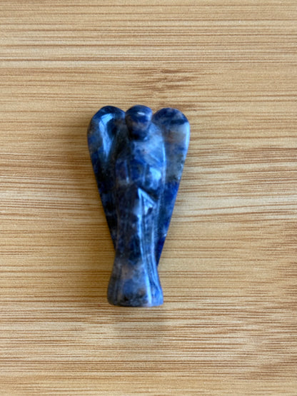 Sodalite angel crystal carving on a wooden background – Suzy's Treasures