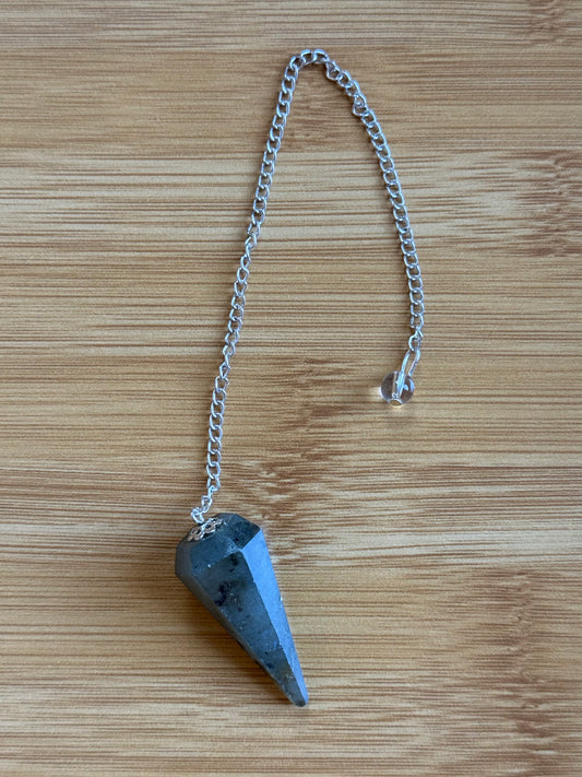 Labradorite long crystal pendulum with silver chain on wooden background – Suzys Treasures
