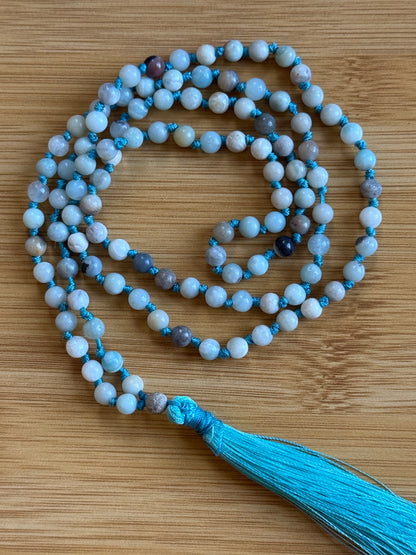 108-bead Amazonite mala necklace with 6mm aqua-toned beads and turquoise tassel, perfect for balance and truth – part of Suzys Treasures collection.