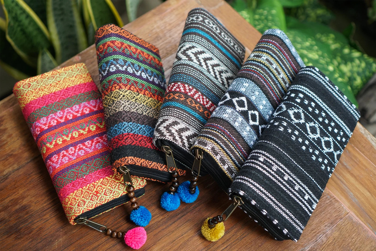 A cheerful lineup of Suzys Treasures wallets, each one a burst of color and culture. These handcrafted beauties come in eye-catching designs and make thoughtful, ethical gifts.