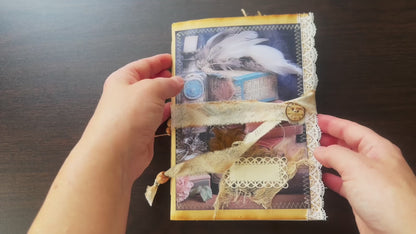 Handmade vintage-inspired journal featuring feathers, apothecary bottles, and lace detailing – a whimsical creation from Suzys Treasures.